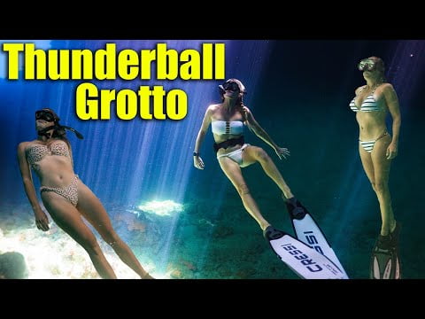 Beautiful women dive at Thunderball Grotto